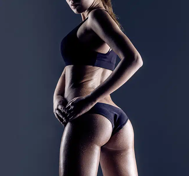 Picture of a woman showcasing the results of a buttock procedure