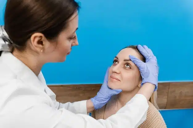 Doctor discussing options with patient during facial surgery consultation