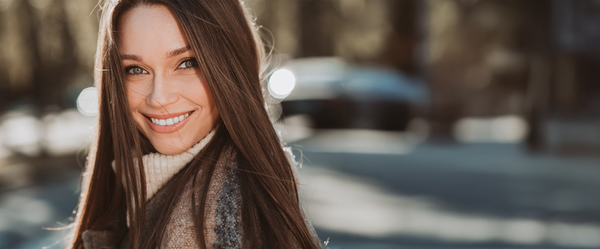 Woman smiling confidently after pdgf-bb hair treatment for non-invasive hair restoration and scalp rejuvenation