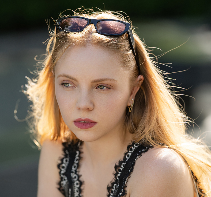 Young woman with smooth, radiant skin showing natural results after Sculptra treatment for facial volume restoration