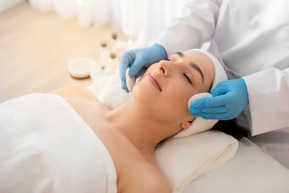 Patient receiving facial treatment with clinician, illustrating PRF EZ Gel process and professional aesthetic procedure steps