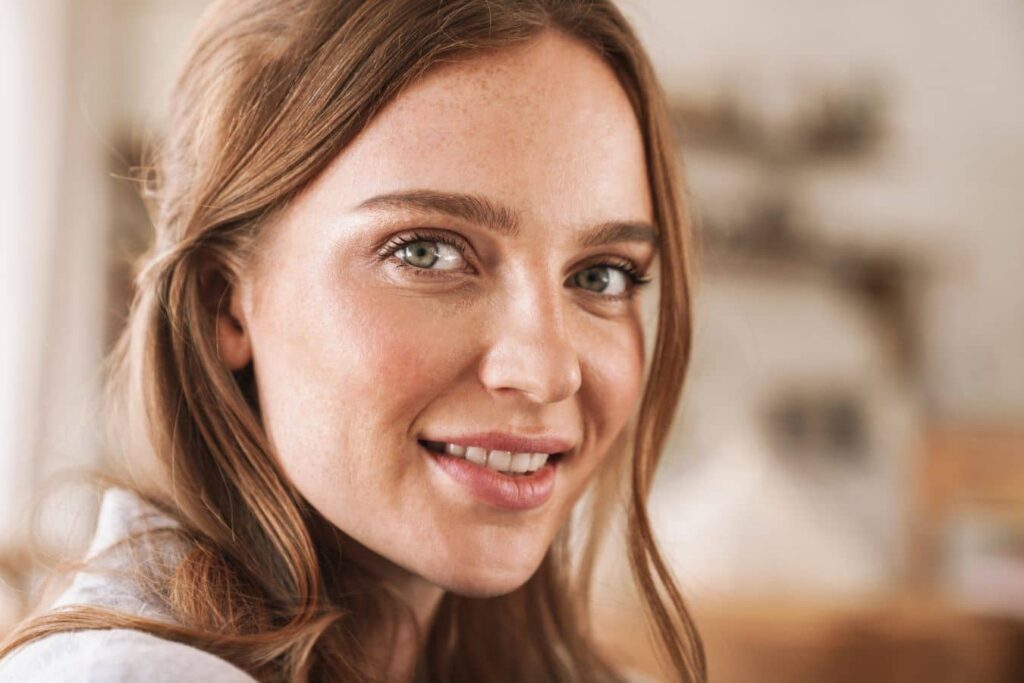 Young woman with natural features representing dermal fillers in your 20s for subtle facial enhancement.